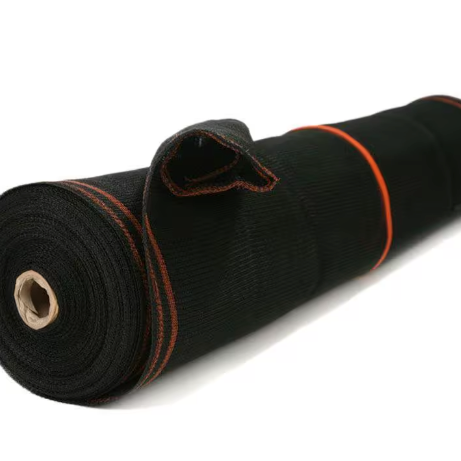 The Go Build 8.6 ft. x 150 ft. Black Fire Resistant Debris Safety Netting features red stitching and a cardboard tube, offering OSHA-compliant enhanced protection and durability for construction safety on site.